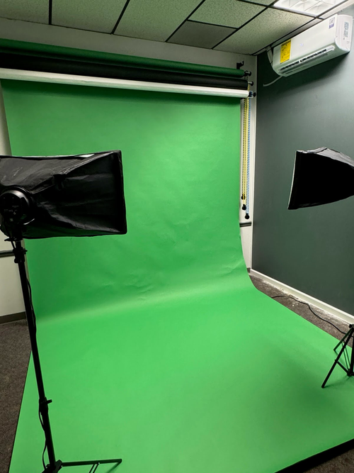 PAD Studios Media Room at PAD 2 featuring green screen backdrop with photo and video production equipment